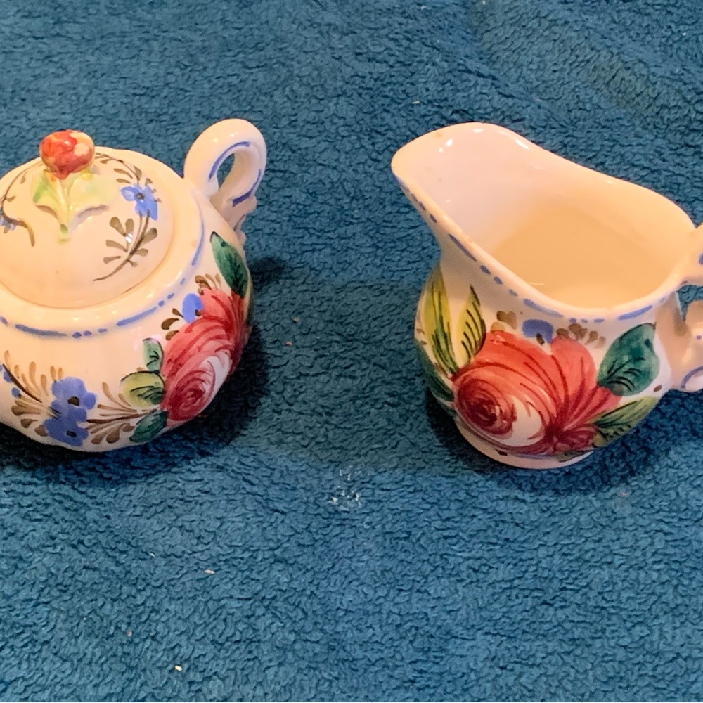 Italian/Renaissance style rose motif set of creamer and sugar bowl with lid.